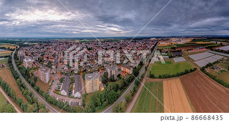 Drone panorama over German municipality Weiterstadt in southern Hesse during sunset Drone panorama over German municipality Weiterstadt in southern Hesse during sunset 86668435