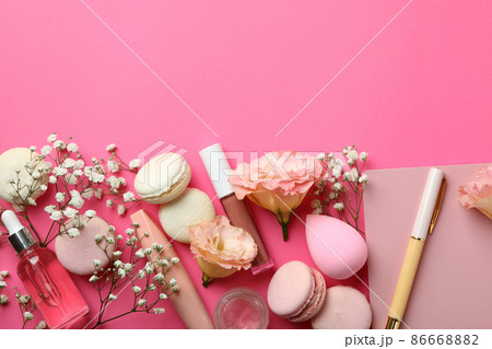 Female accessories and macaroons on pink background 86668882
