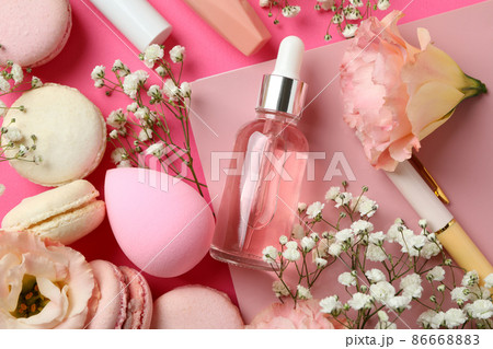 Female accessories and macaroons on pink background 86668883