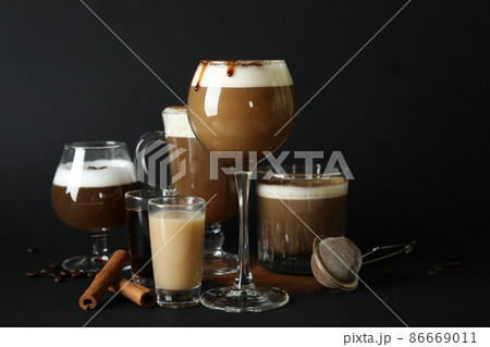 Concept of delicious drink with Irish coffee on black background Concept of delicious drink with Irish coffee on black background 86669011
