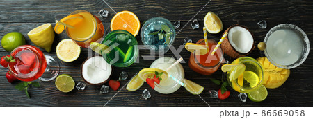 Fresh summer cocktails on rustic wooden table Fresh summer cocktails on rustic wooden table 86669058