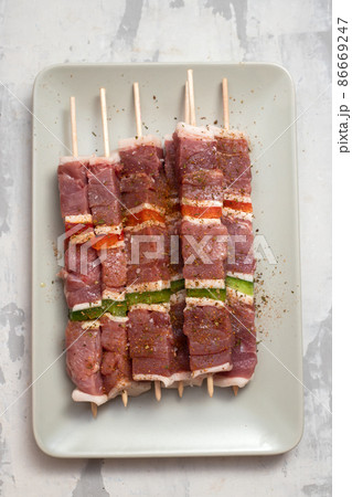 meat with pepper for barbecue on the dish meat with pepper for barbecue on the dish 86669247