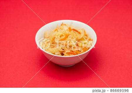 salted cabbage with carrot in white bowl 86669396
