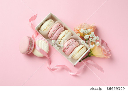 Concept of tasty dessert with macaroons on pink background 86669399