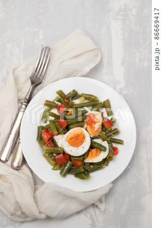 healthy salad green beans, pepper and boiled eggs on plate healthy salad green beans, pepper and boiled eggs on plate 86669417