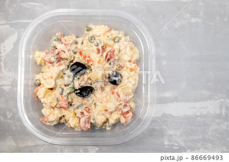 typical vegetable salad with sauce in plastic box typical vegetable salad with sauce in plastic box 86669493