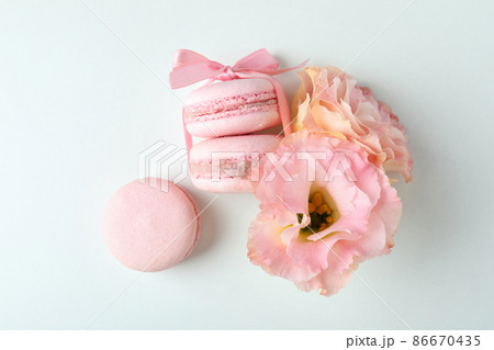 Concept of tasty dessert with macaroons on white background Concept of tasty dessert with macaroons on white background 86670435