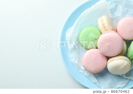 Concept of tasty dessert with macaroons on white background Concept of tasty dessert with macaroons on white background 86670462