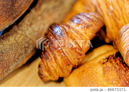 Selection of French pastries and a baguette Selection of French pastries and a baguette 86673371
