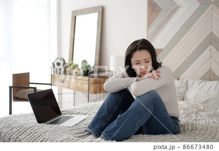 Young asian woman read bad news on laptop look desperate, feels stressed, important data loss, notice form bank about debt, upset user customer using laptop feel frustrated mad about computer problem 86673480