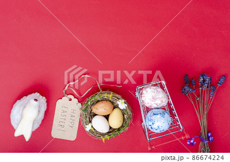 Grocery supermarket cart filled with chicken eggs. Concept of preparing for Easter, buying food. Space for text. Studio Photo 86674224
