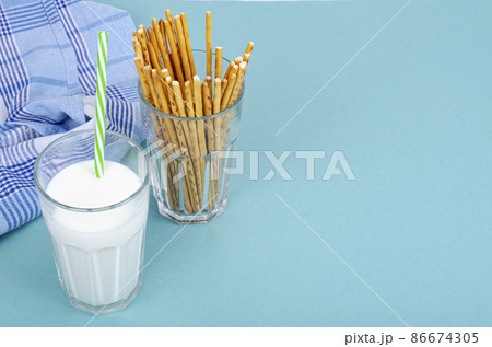 Delicious cookies and glass of milk on bright background. Studio Photo Delicious cookies and glass of milk on bright background. Studio Photo 86674305