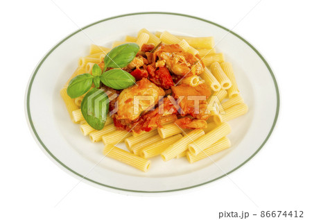Pasta with pieces of chicken, tomatoes and sweet paprika. 86674412