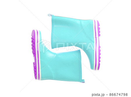 Children's pink rubber boots for walking on white. Children's pink rubber boots for walking on white. 86674798