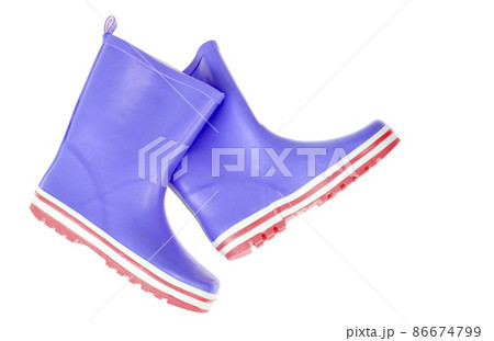 Children's pink rubber boots for walking on white. Children's pink rubber boots for walking on white. 86674799