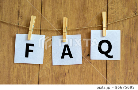 FAQ frequently asked questions symbol. Concept words FAQ frequently asked questions on white papers on a beautiful wooden background. Business and FAQ frequently asked questions concept. 86675695