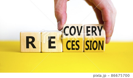 Recovery and recession symbol. Businessman hand turns cubes and changes the word 'recession' to 'recovery'. Beautiful white background. Business and recovery - recession concept. Copy space. 86675700