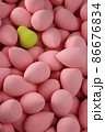 beauty background a bunch of pink gentle sponges and one contrast green conflict for makeup vertical orientation 86676834