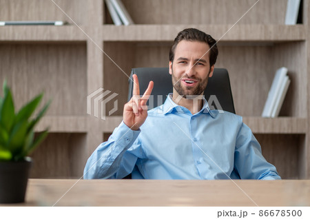 A manager in a blue shirt feeling joyful and happy 86678500