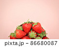 Half top view of strawberries in a cup with copy space. 86680087