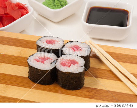 sushi roll with tuna in nori seaweed on a wooden Board sushi roll with tuna in nori seaweed on a wooden Board 86687448