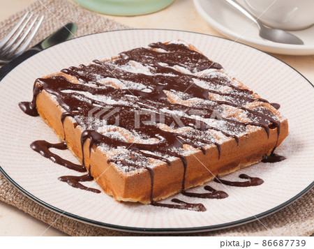 traditional tasty sweet Belgian waffle with chocolate traditional tasty sweet Belgian waffle with chocolate 86687739