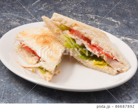 sandwich or toast with chicken breast and vegetables. Concept sandwich or toast with chicken breast and vegetables. Concept 86687892