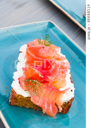 bruschetta with cream cheese and salmon in the restaurant 86688514