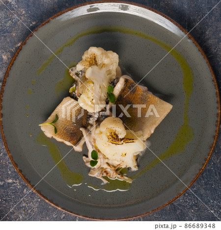 tasty baked pike-perch with cauliflower. Top view 86689348