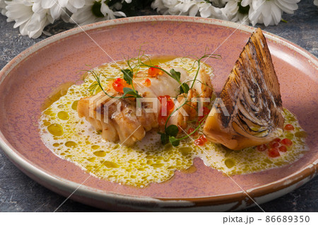 white fish baked with cabbage. Horizontal frame white fish baked with cabbage. Horizontal frame 86689350