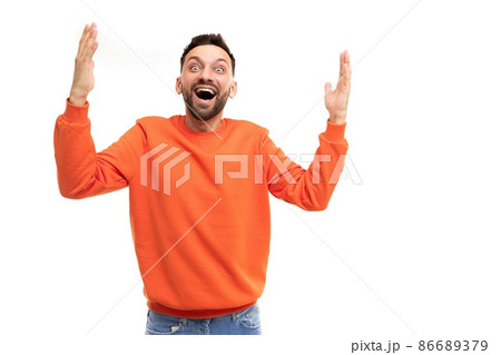 joyful happy man emotionally waving his hands gesturing with open mouth and smile 86689379