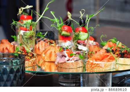 snacks on glass at a buffet in a restaurant 86689610