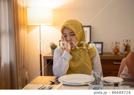 tired woman having break fast or sahur in the morning tired woman having break fast or sahur in the morning 86689728
