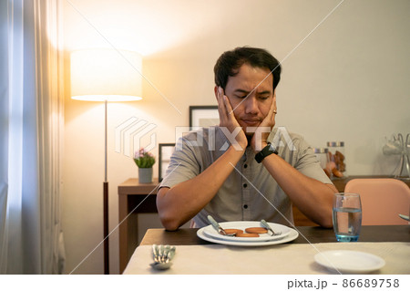 impatient muslim male waiting to break his fast impatient muslim male waiting to break his fast 86689758