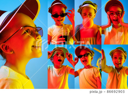 Learning to show feelings. Photo set of images of little kid, cute girl isolated on blue studio background in neon light. Education, emotions Learning to show feelings. Photo set of images of little kid, cute girl isolated on blue studio background in neon light. Education, emotions 86692903