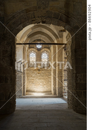 Vaulted passage leading to a wall with two adjacent windows at the Qalawun complex Vaulted passage leading to a wall with two adjacent windows at the Qalawun complex 86692904