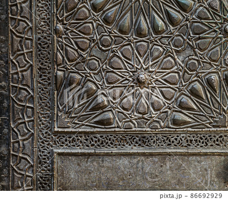 Ornaments of the bronze-plate door of Sultan al-Zahir Barquq Mosque 86692929