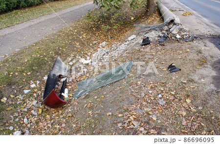 knocked down post broken glass and bumper at the scene of a car accident knocked down post broken glass and bumper at the scene of a car accident 86696095