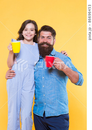 Increase energy level. Little child and father hold cups  86696453
