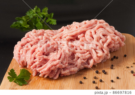 fresh raw minced chicken on a wooden Board 86697816
