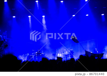 Blue stage lights and crowd at concert Blue stage lights and crowd at concert 86701440