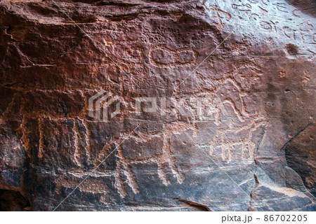 Nabatean and Thamudic inscriptions on rock in Wadi Rum desert 86702205