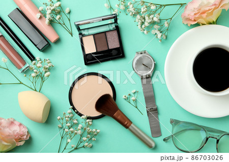 Female accessories and macaroons on mint background Female accessories and macaroons on mint background 86703026