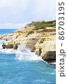 Ocean waves splash against beach with rocks background, Cliffs in the sea, Top aerial view of Cyprus, Nature Background with Sea, Vacation and relax 86703195