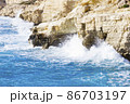 Ocean waves splash against beach with rocks background, Cliffs in the sea, Top aerial view of Cyprus, Nature Background with Sea, Vacation and relax 86703197
