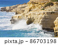 Ocean waves splash against beach with rocks background, Cliffs in the sea, Top aerial view of Cyprus, Nature Background with Sea, Vacation and relax 86703198
