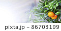 Orange Mandarins on the tree, Tangerine plantation, rich of vitamin c fruit, selective focus, banner 86703199