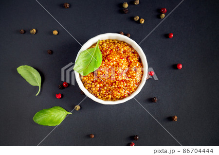 Bowl of grainy dijon mustard or top view 86704444
