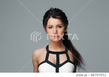 Peaceful lovely woman with long hair Isolated on 86707052