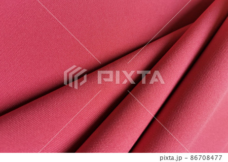 Pink crumpled or wavy fabric texture background. Abstract linen cloth soft waves. Gabardine wool fabric. Merino yarn. Smooth elegant luxury cloth texture. Concept for banner or advertisement. 86708477